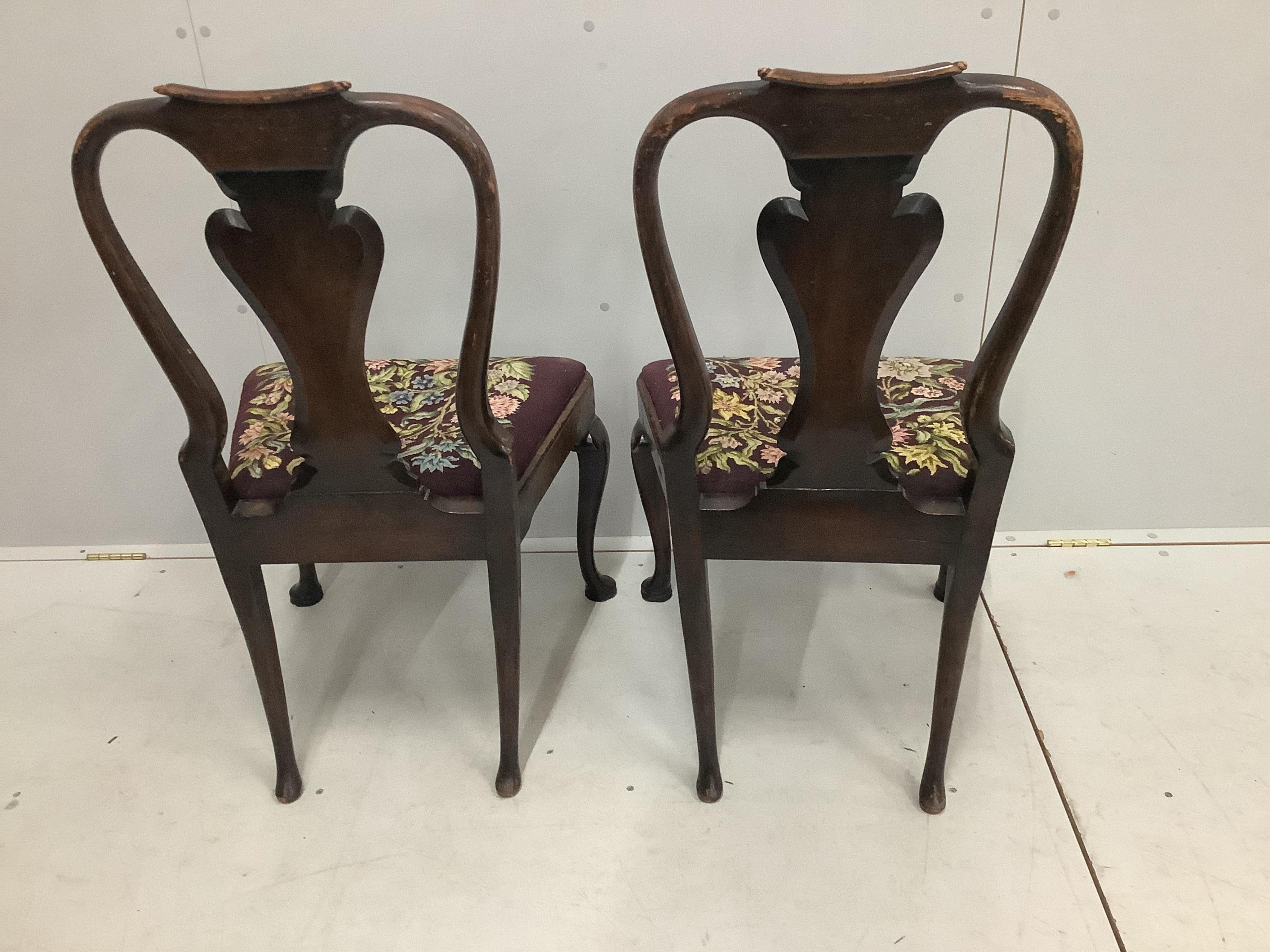 A pair of Queen Anne style walnut dining chairs, height 97cm. Condition - poor